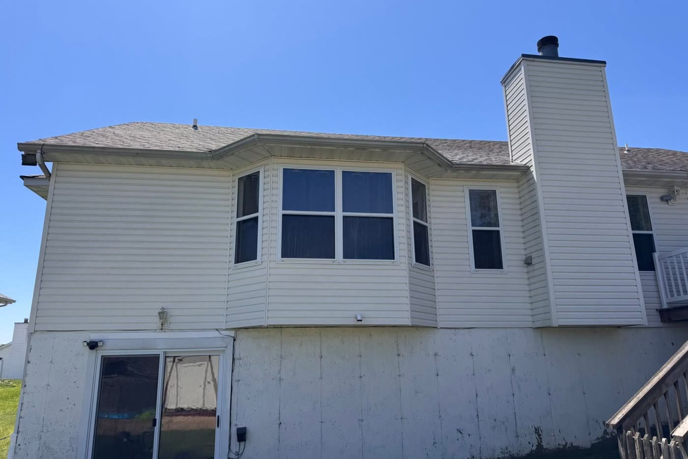 The same siding, clean and bright after a soft wash